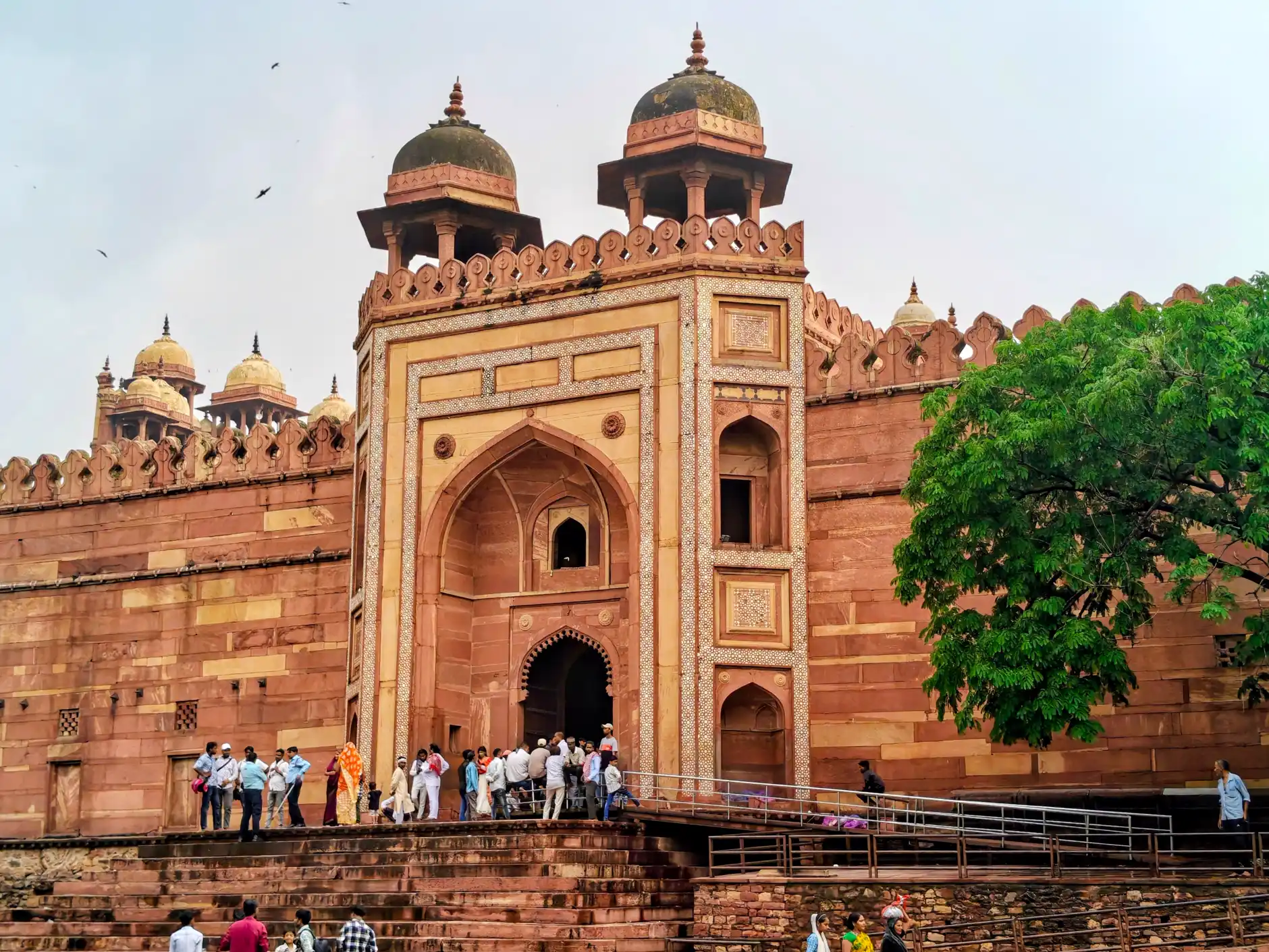 Buland Darwaza, the monumental red sandstone gateway at Fatehpur Sikri, with visitors at its entrance