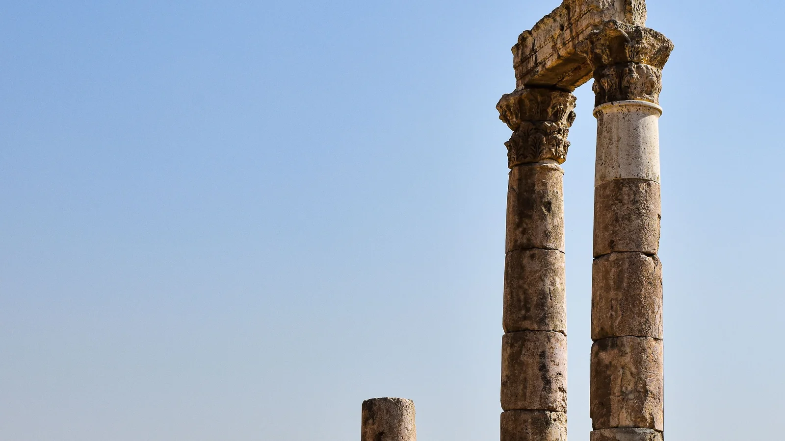 A close view of the surviving columns and carved capitals of the Temple of Hercules at Amman Citadel.