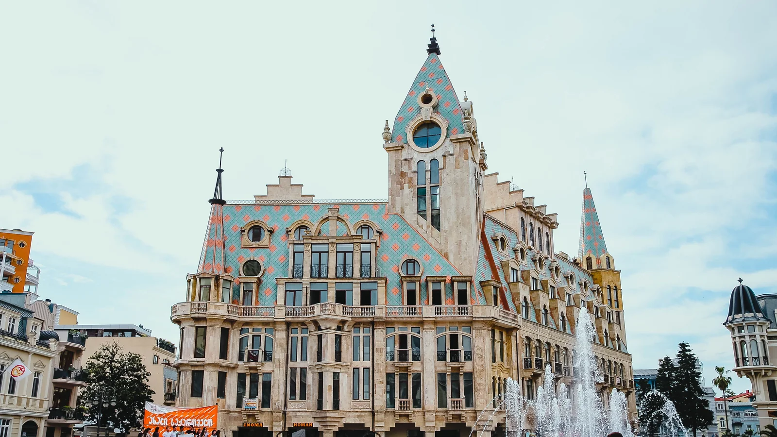 Ornate buildings and the fountain at Europe Square in Batumi.