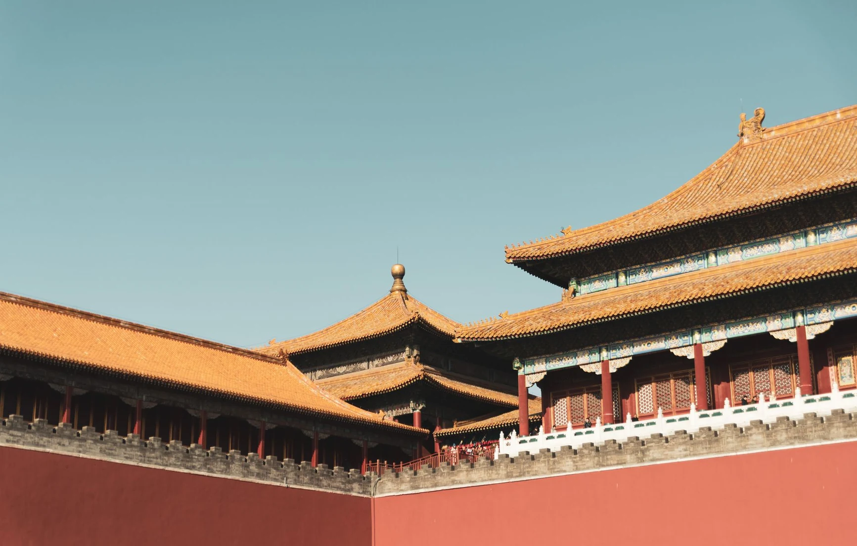 Red walls and golden-roofed pavilions at the Forbidden City in Beijing