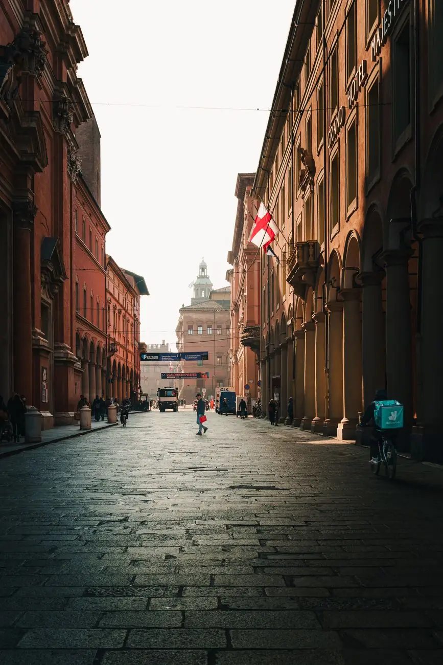 Bologna’s central porticoed street looking towards a historic dome