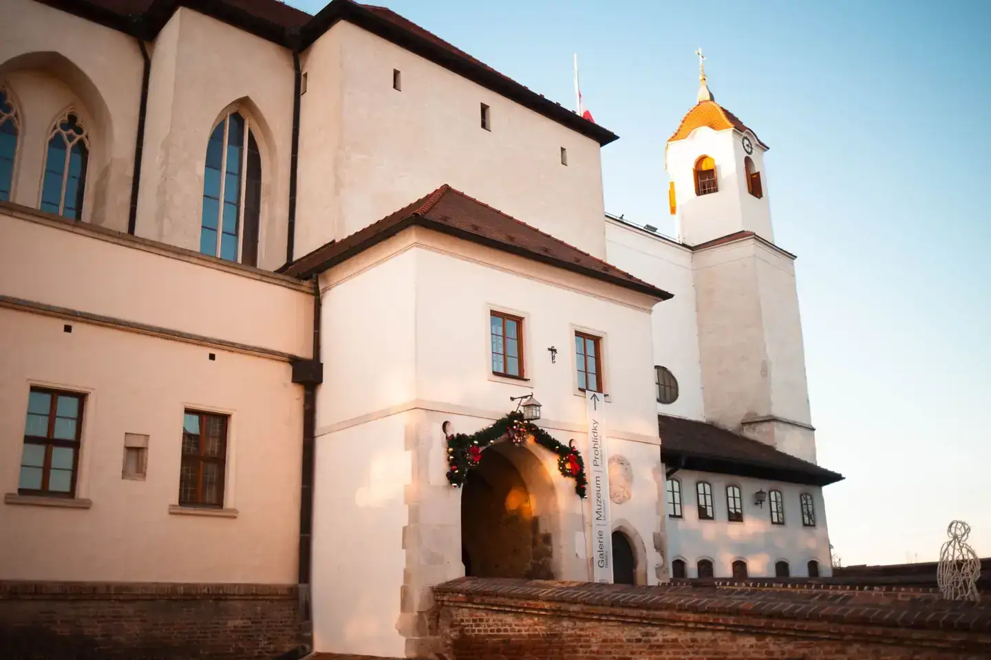 Špilberk Castle’s pale walls, Gothic windows, entrance and small clock tower
