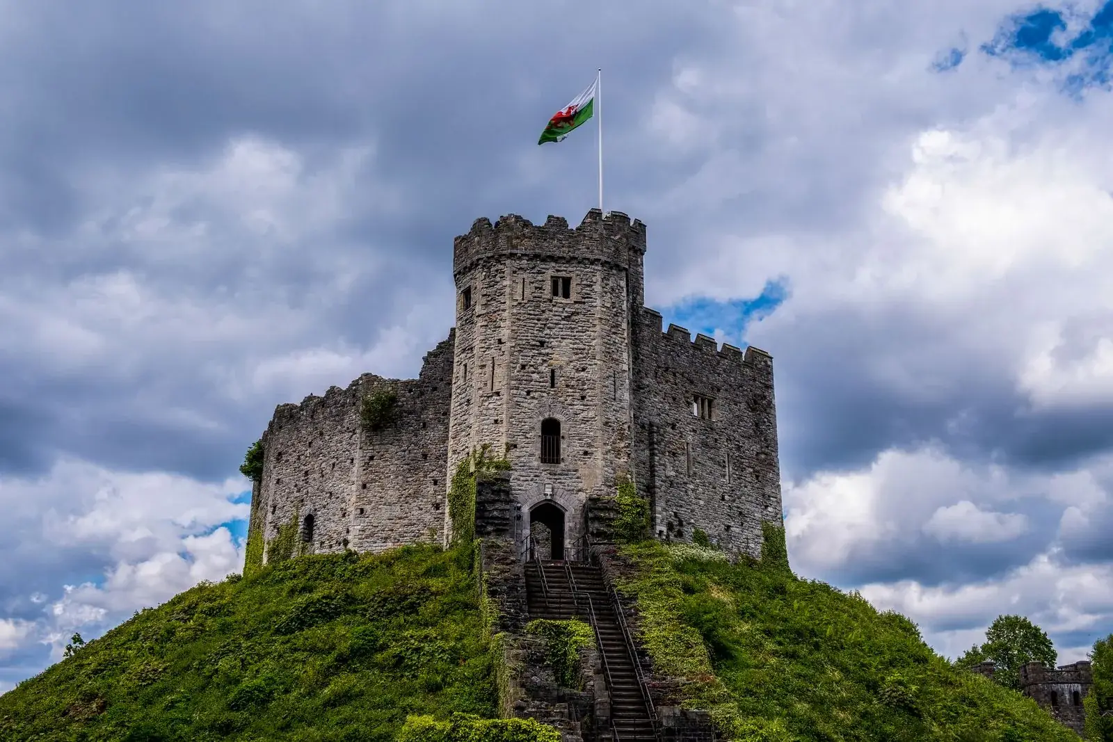 The stone keep of Cardiff Castle beneath a cloudy sky