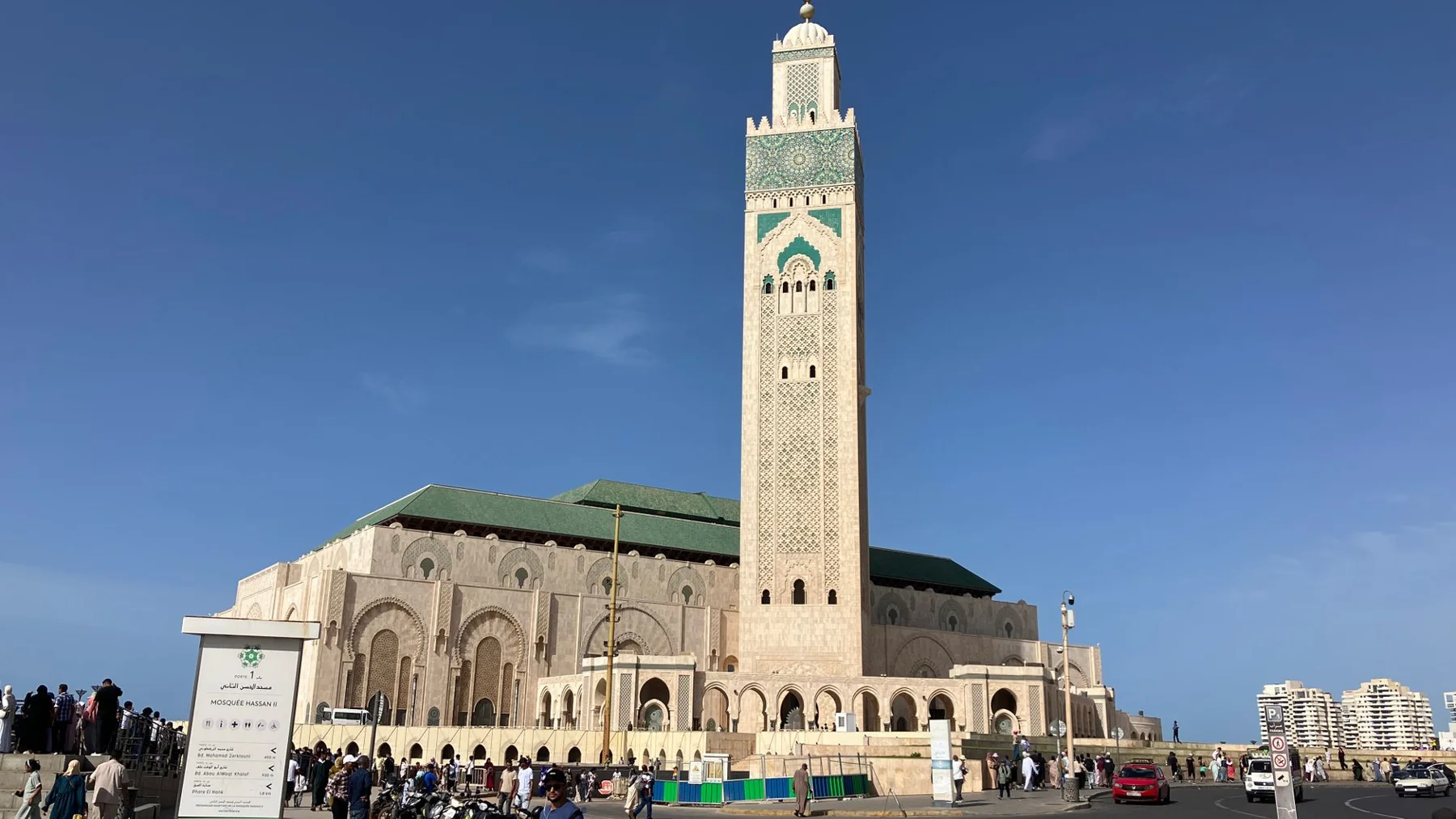 Hassan II Mosque and its minaret above visitors on the Casablanca esplanade