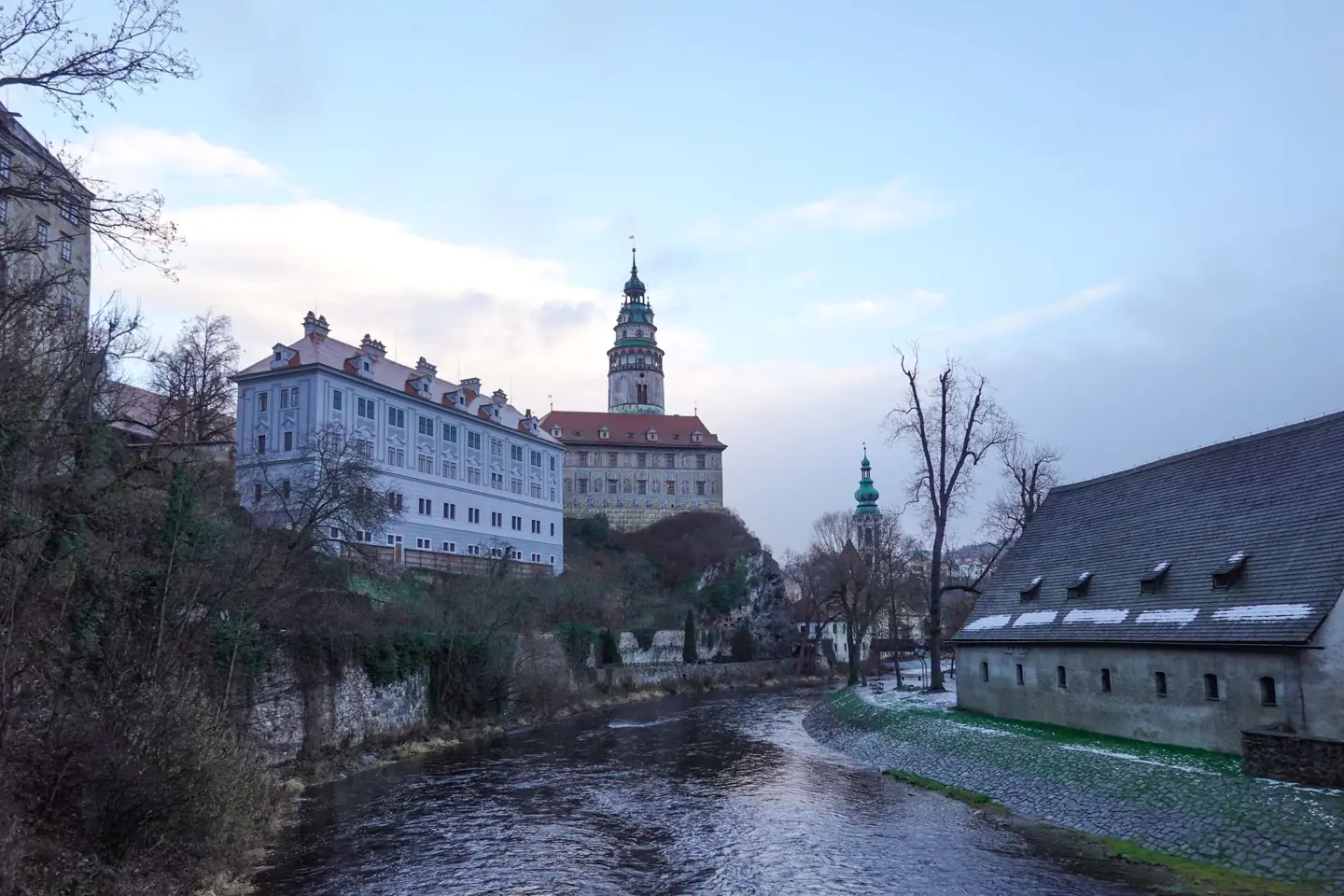 Český Krumlov Castle and tower above the Vltava on a winter evening