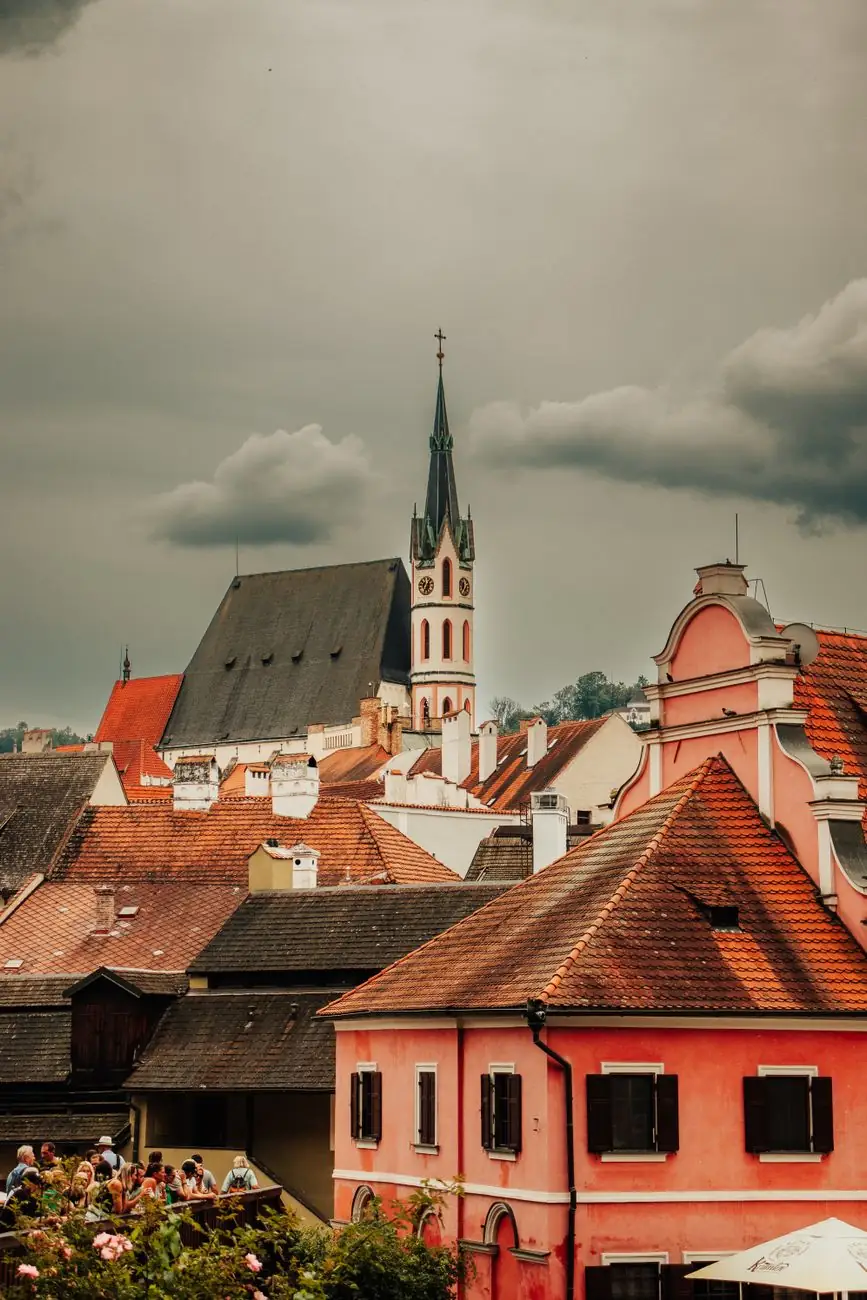 Saint Vitus Church’s pointed spire above Český Krumlov’s inner-town rooftops