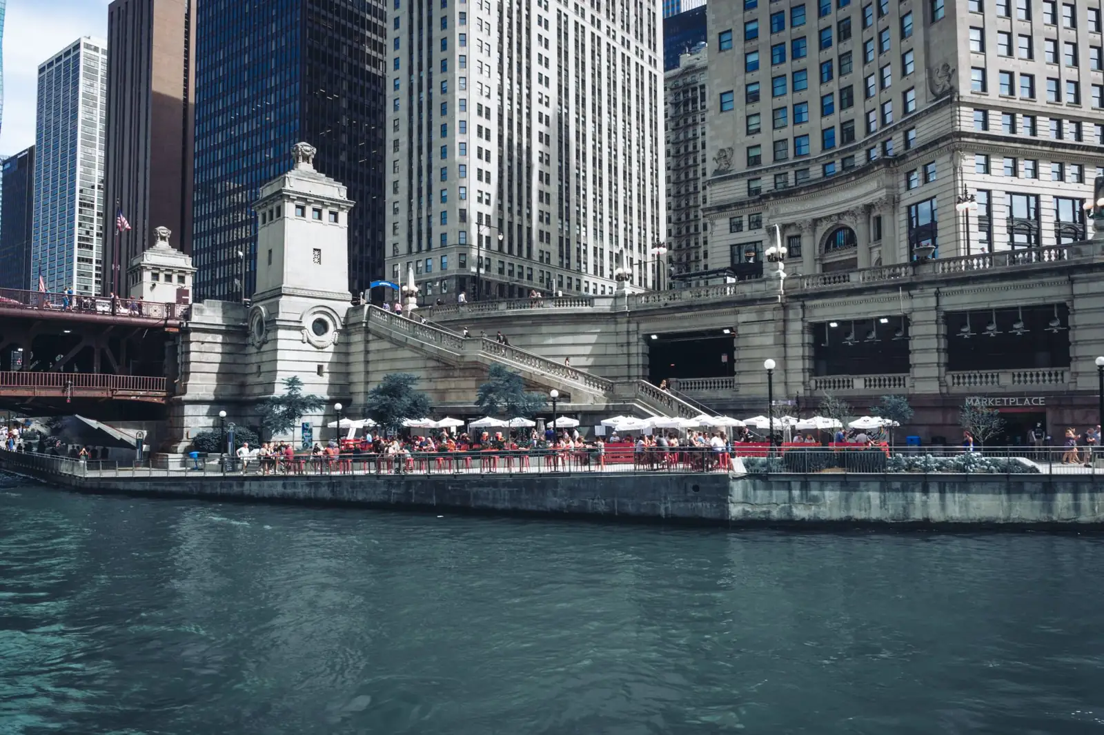 Chicago Riverwalk beside the Michigan Avenue bridge and historic riverfront buildings