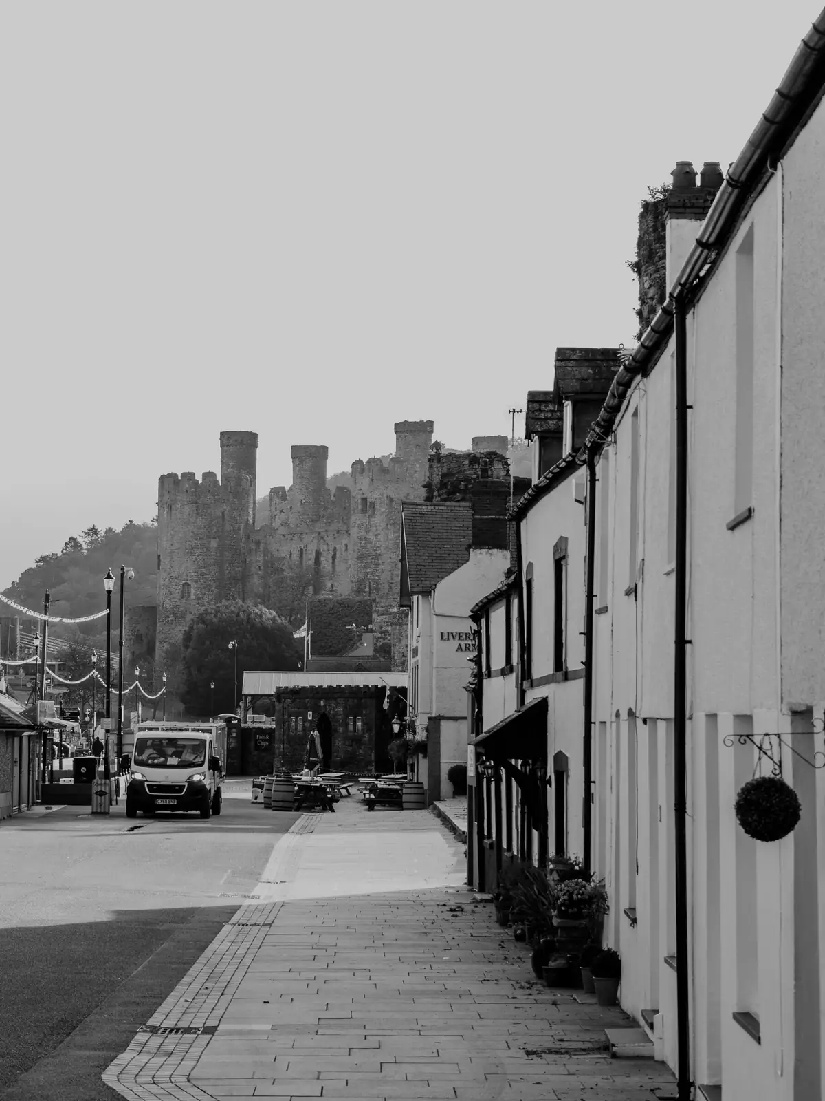 Conwy Castle’s medieval stone towers in a black and white view