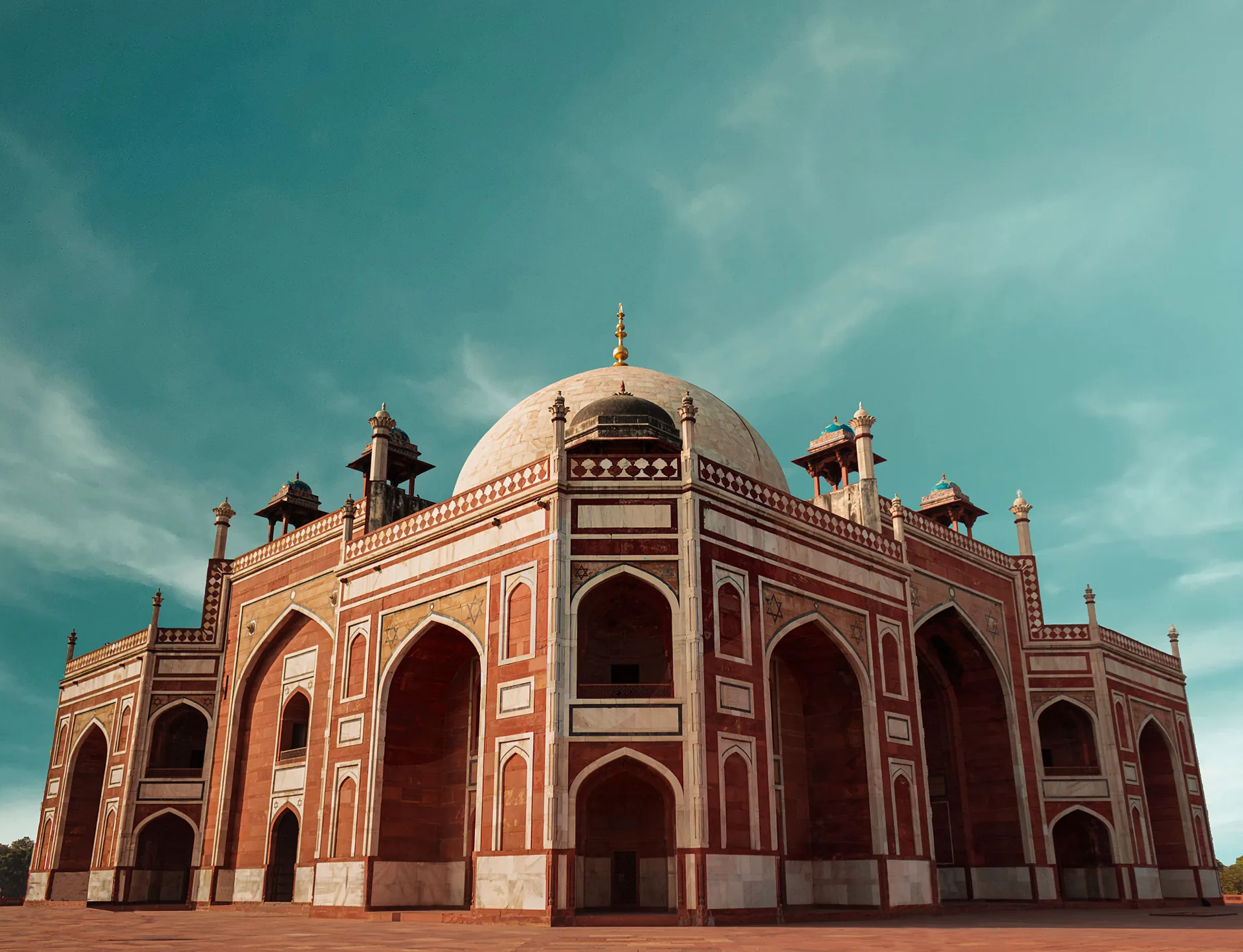 Angled view of Humayun’s Tomb showing white marble inlay and its domed roof in Delhi