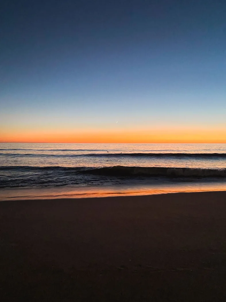 Ocean waves at sunset on Faro beach