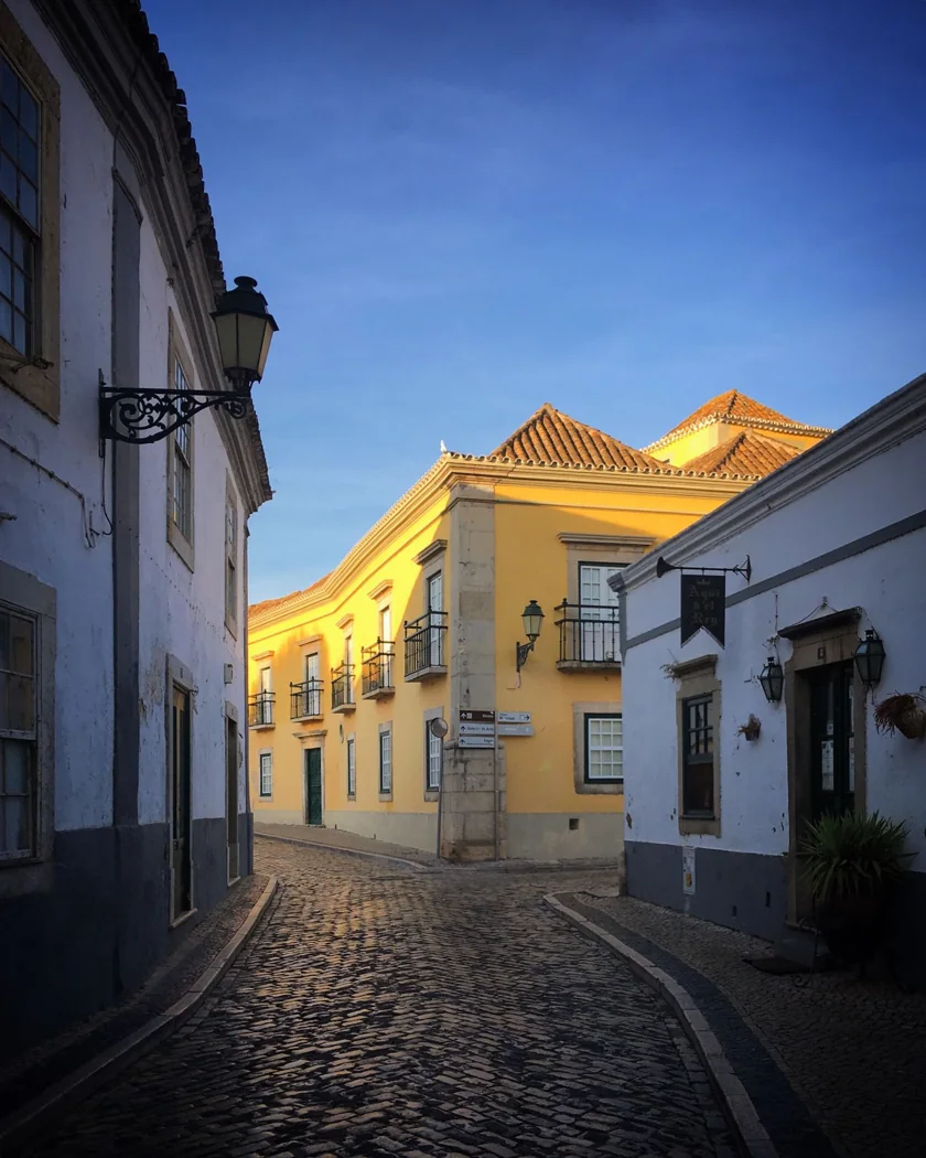 Historic houses along a cobbled street in Faro