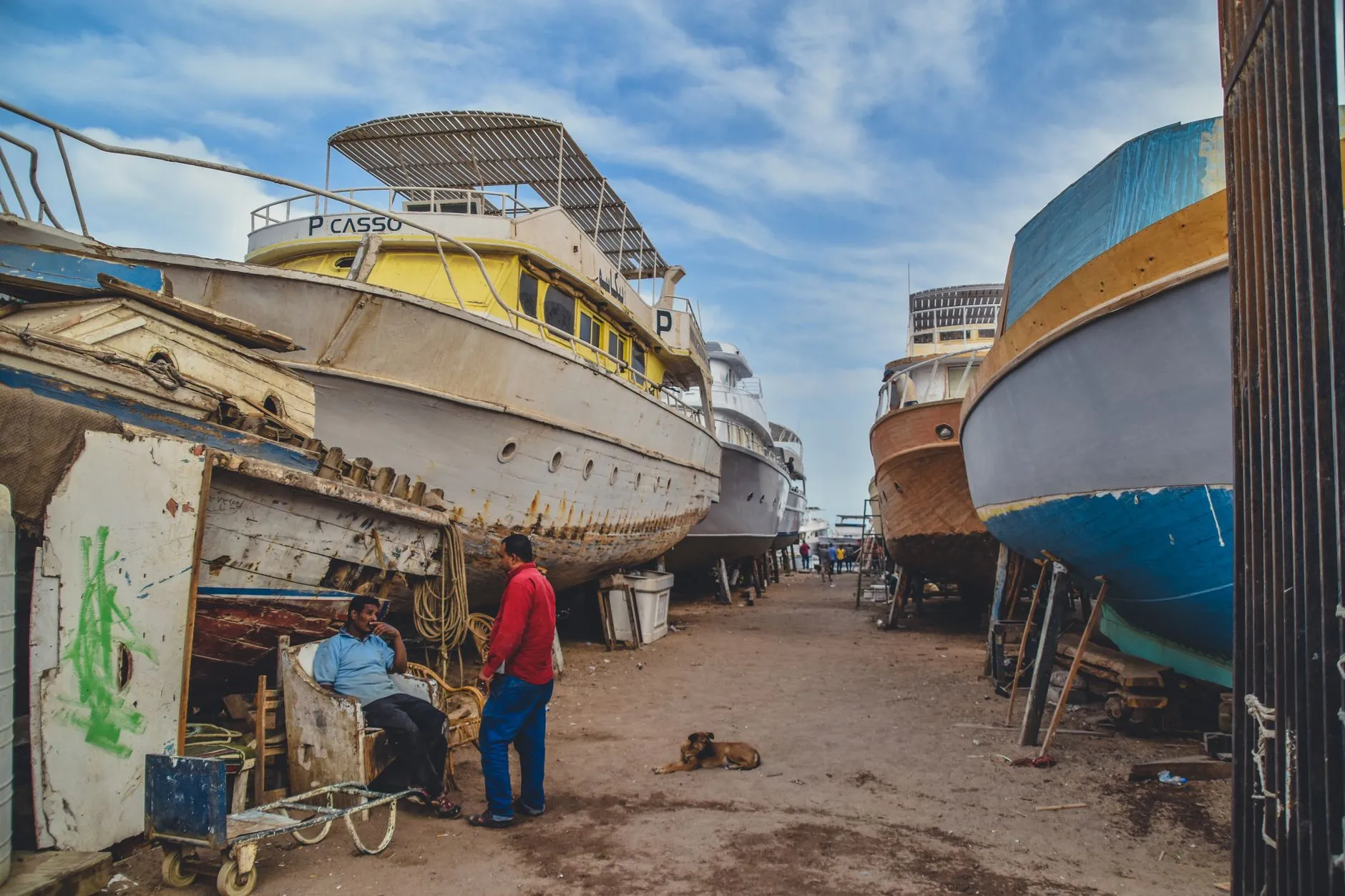 Boats resting on supports in a working boat-repair yard in Hurghada