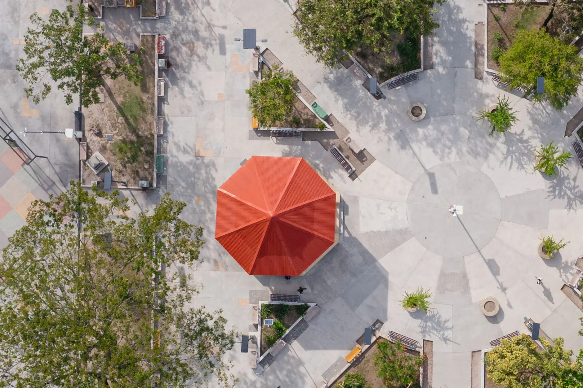 Red-roofed kiosk and geometric paths in Parque Mario Cañas Ruiz in central Liberia, Costa Rica