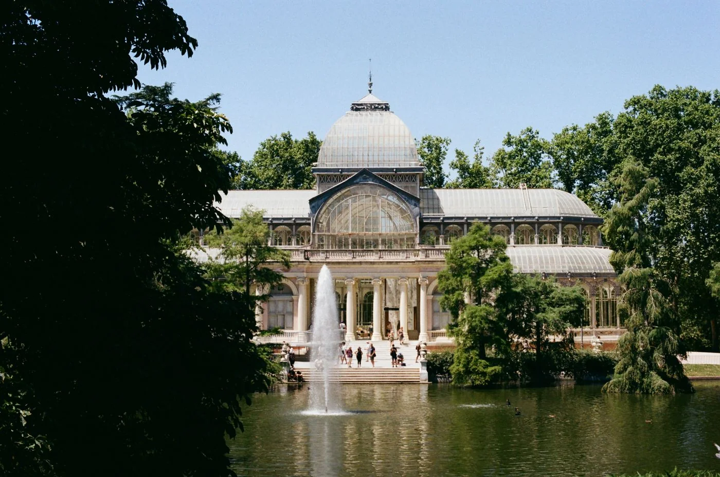 The Crystal Palace among trees in Retiro Park, Madrid