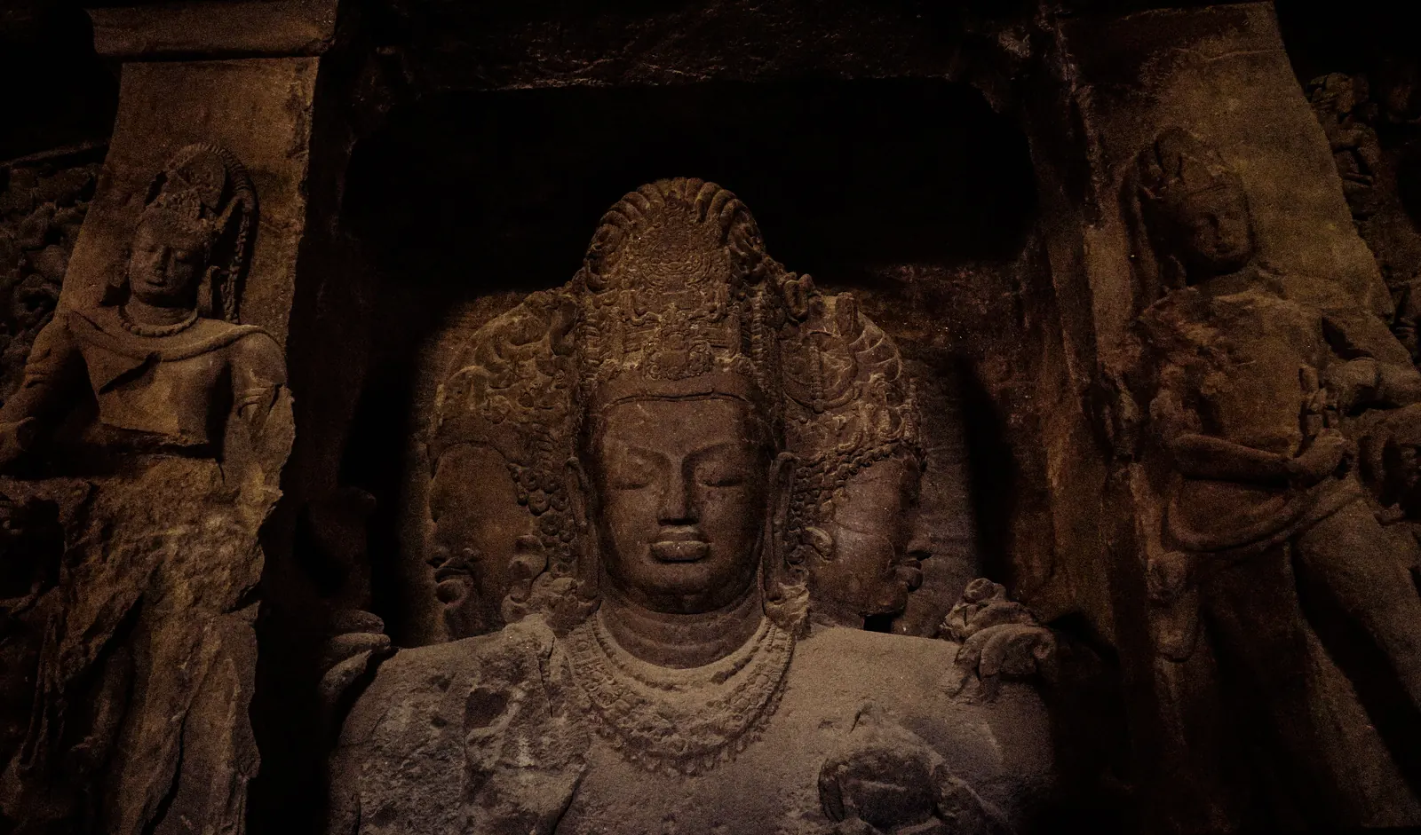 The large carved Shiva relief inside Elephanta Caves near Mumbai