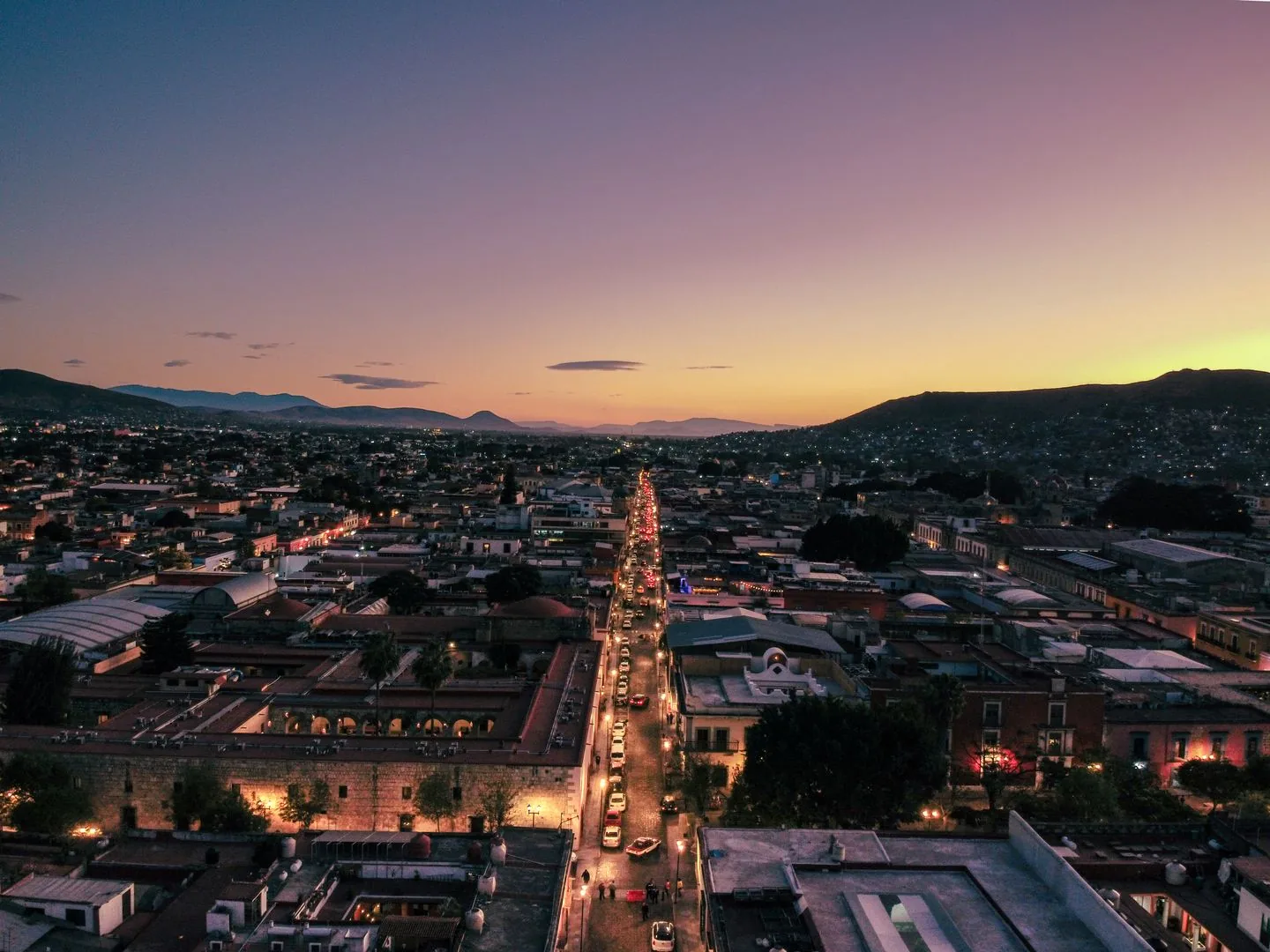 Oaxaca historic centre and illuminated street at sunset