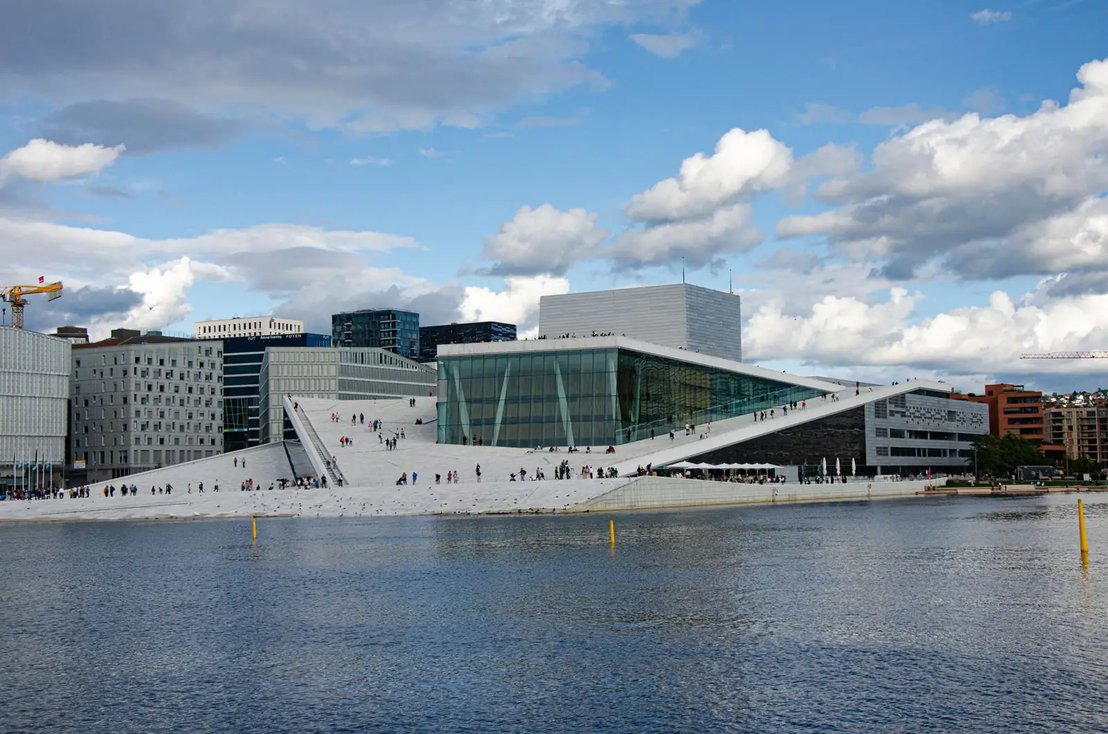 The sloping white roof of Oslo Opera House beside Bjørvika