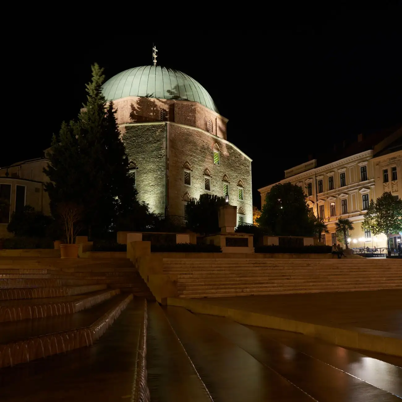 The dome of Gázi Kászim Pasha’s former mosque above Széchenyi Square in Pécs at night