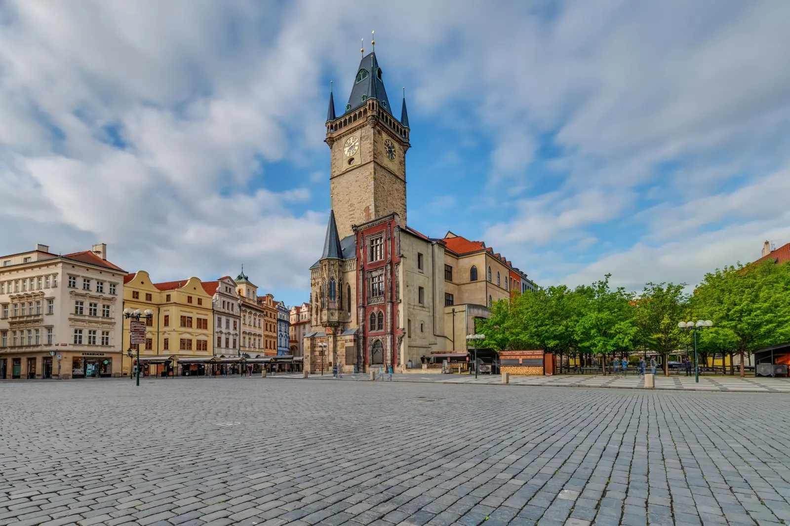 Old Town Hall’s Gothic clock tower rising above Prague’s cobbled Old Town Square