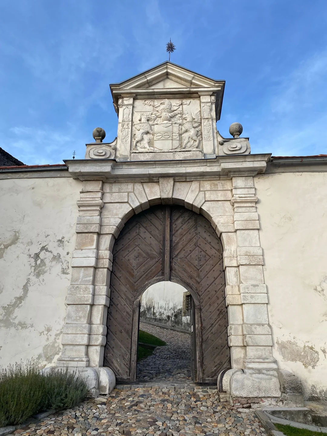 Carved stone entrance portal on the approach to Ptuj Castle