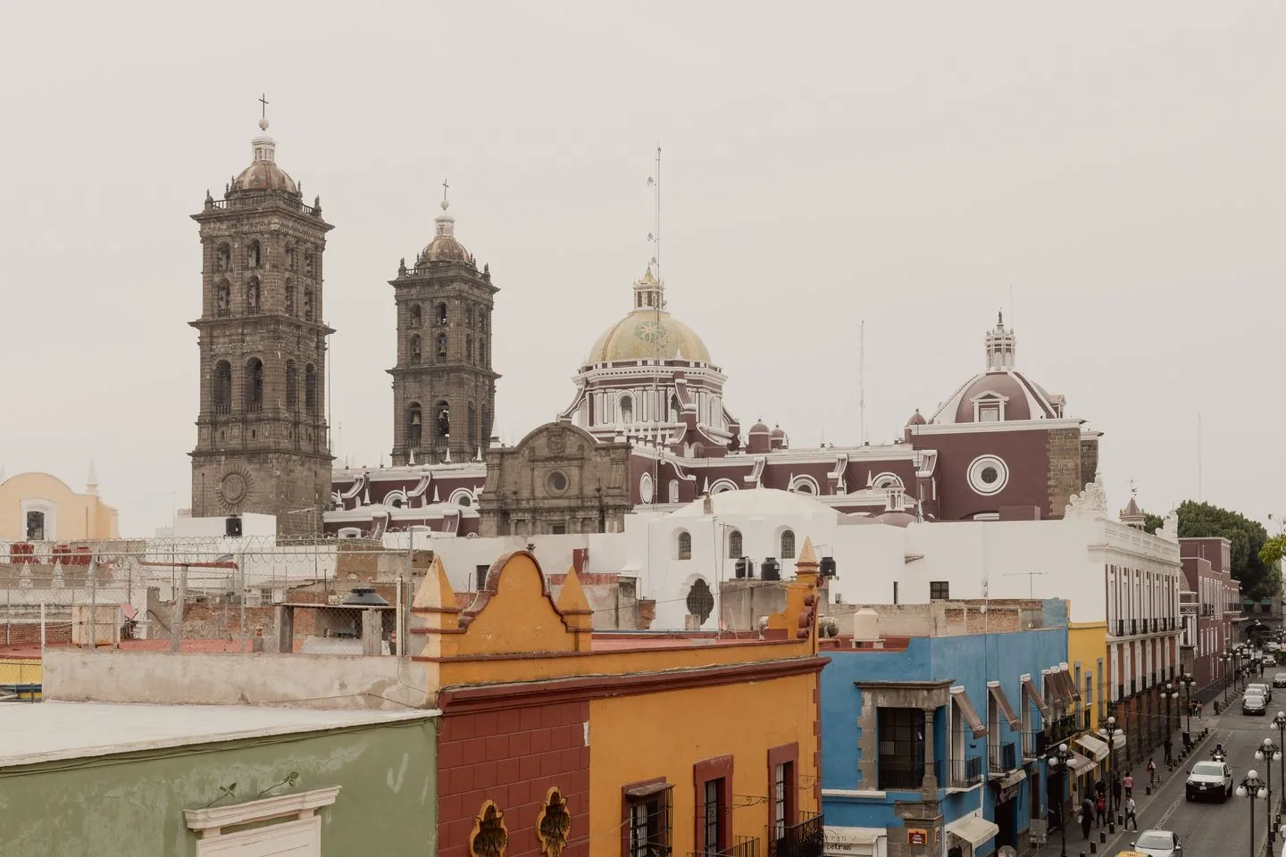 Puebla Cathedral dome and tower above colourful historic-centre buildings