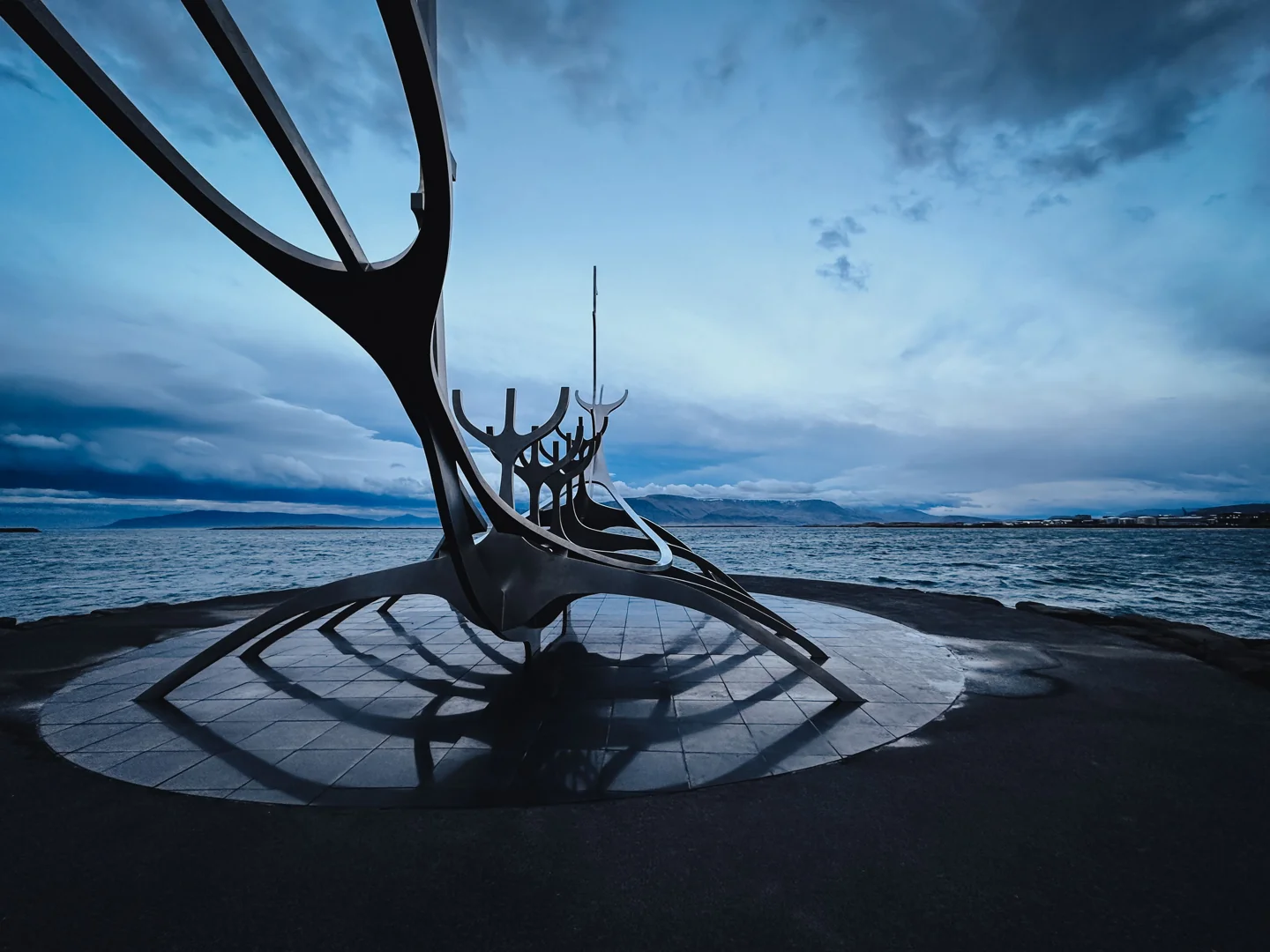 The steel Sun Voyager sculpture beside Reykjavík’s waterfront beneath a cloudy sky