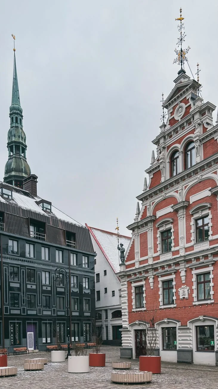 House of the Blackheads frontage with St Peter’s spire beyond Riga’s Town Hall Square