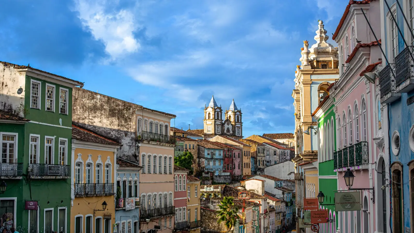 Colourful Pelourinho façades with São Francisco’s towers at the end of the street