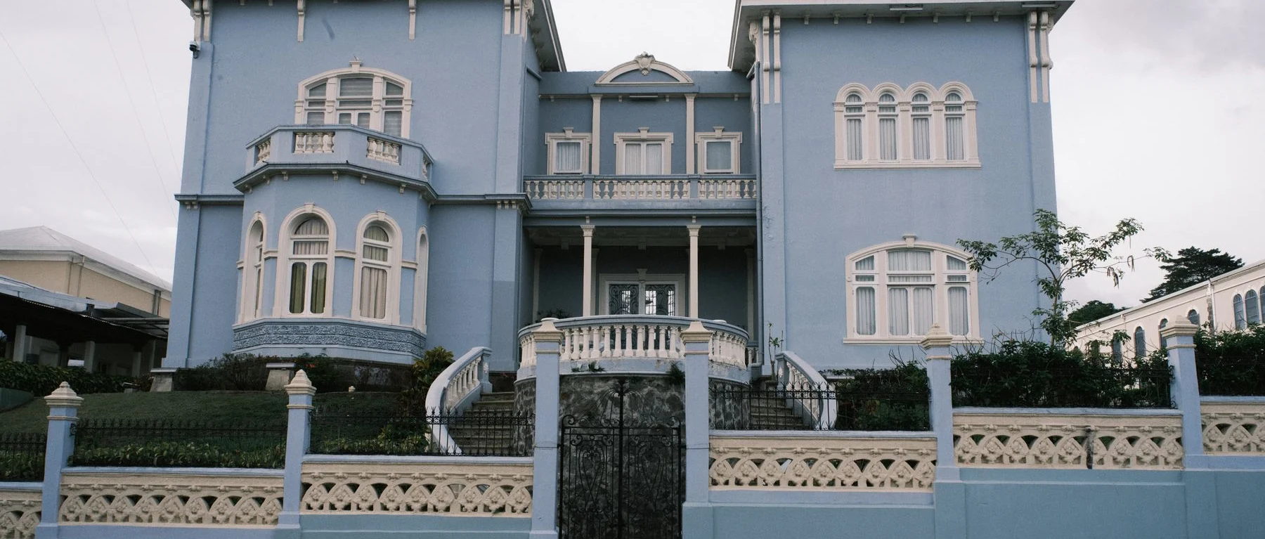 Blue façade, bay window and balcony of Castillo Azul in central San José, Costa Rica
