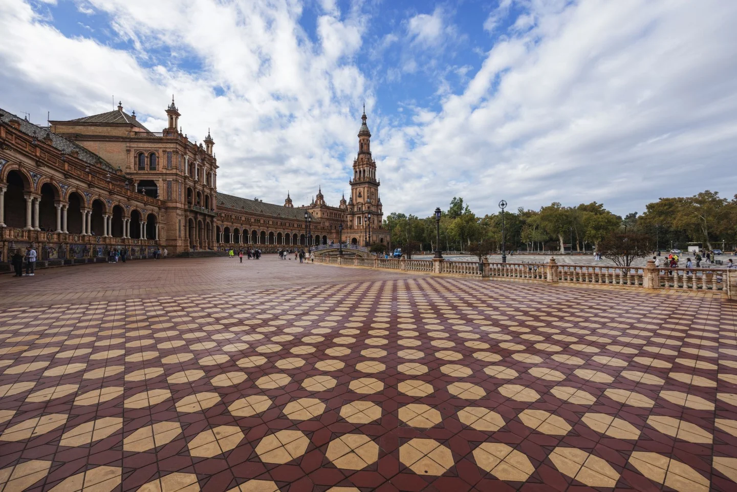 The tiled square, arcaded façade and tower of Plaza de España in Seville
