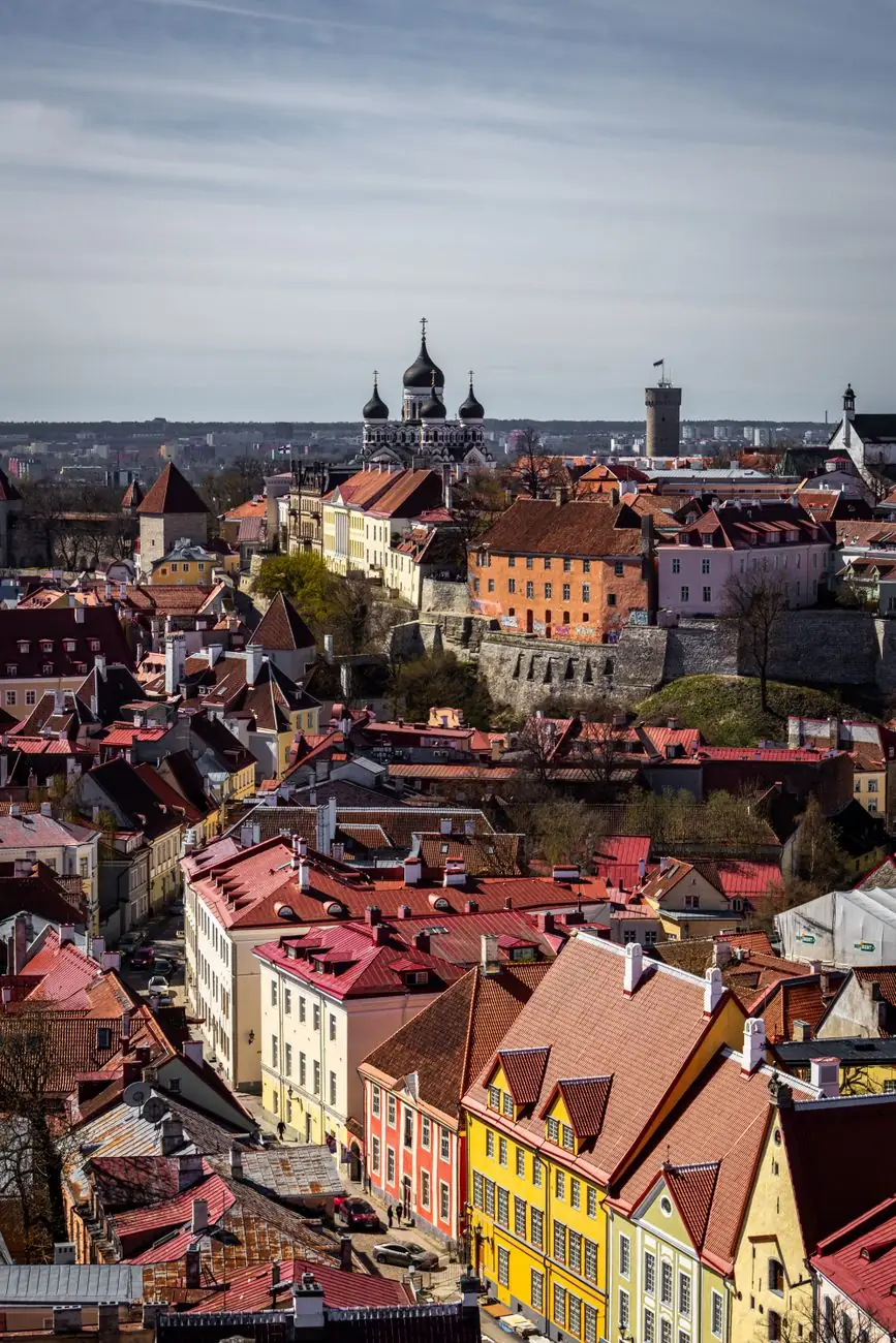 Tallinn’s red rooftops below Toompea, with Alexander Nevsky Cathedral’s domes and the Pikk Hermann tower beyond