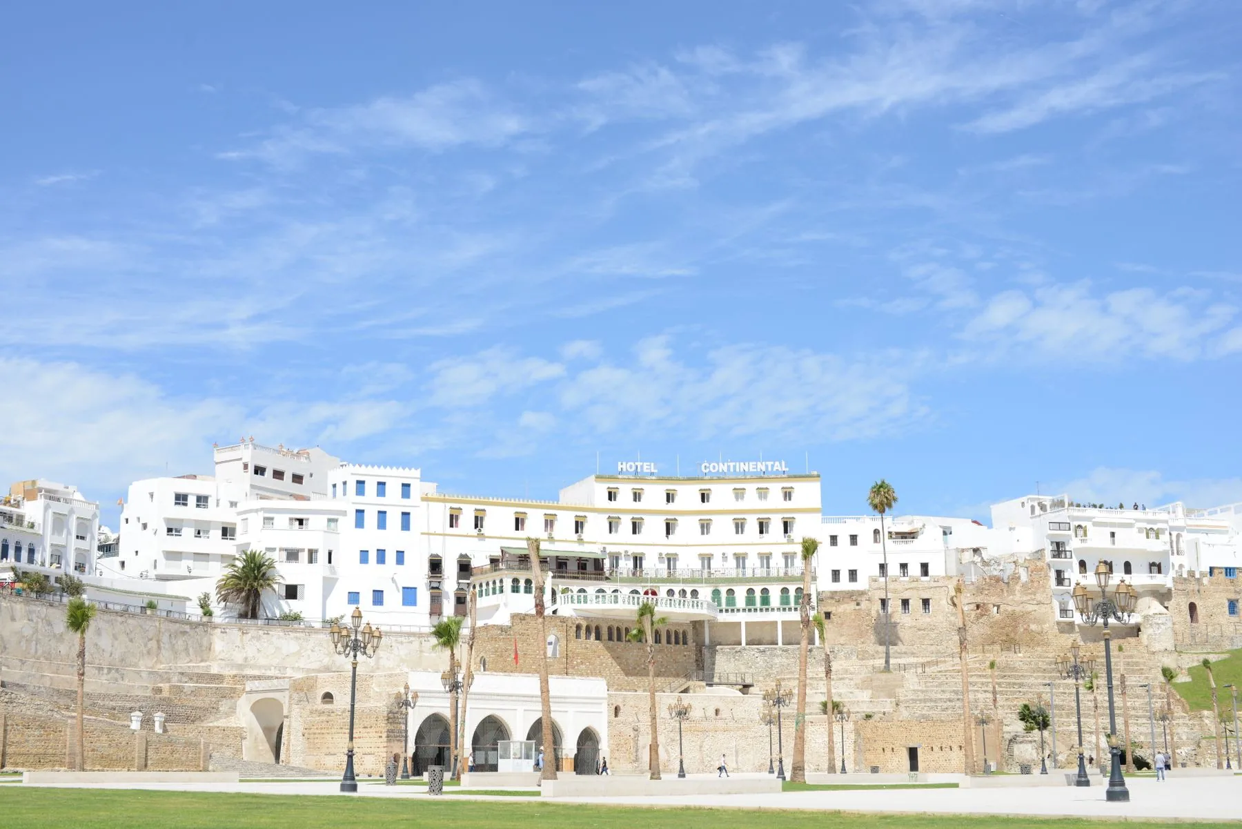 Hotel Continental above the old harbour walls and white medina buildings in Tangier