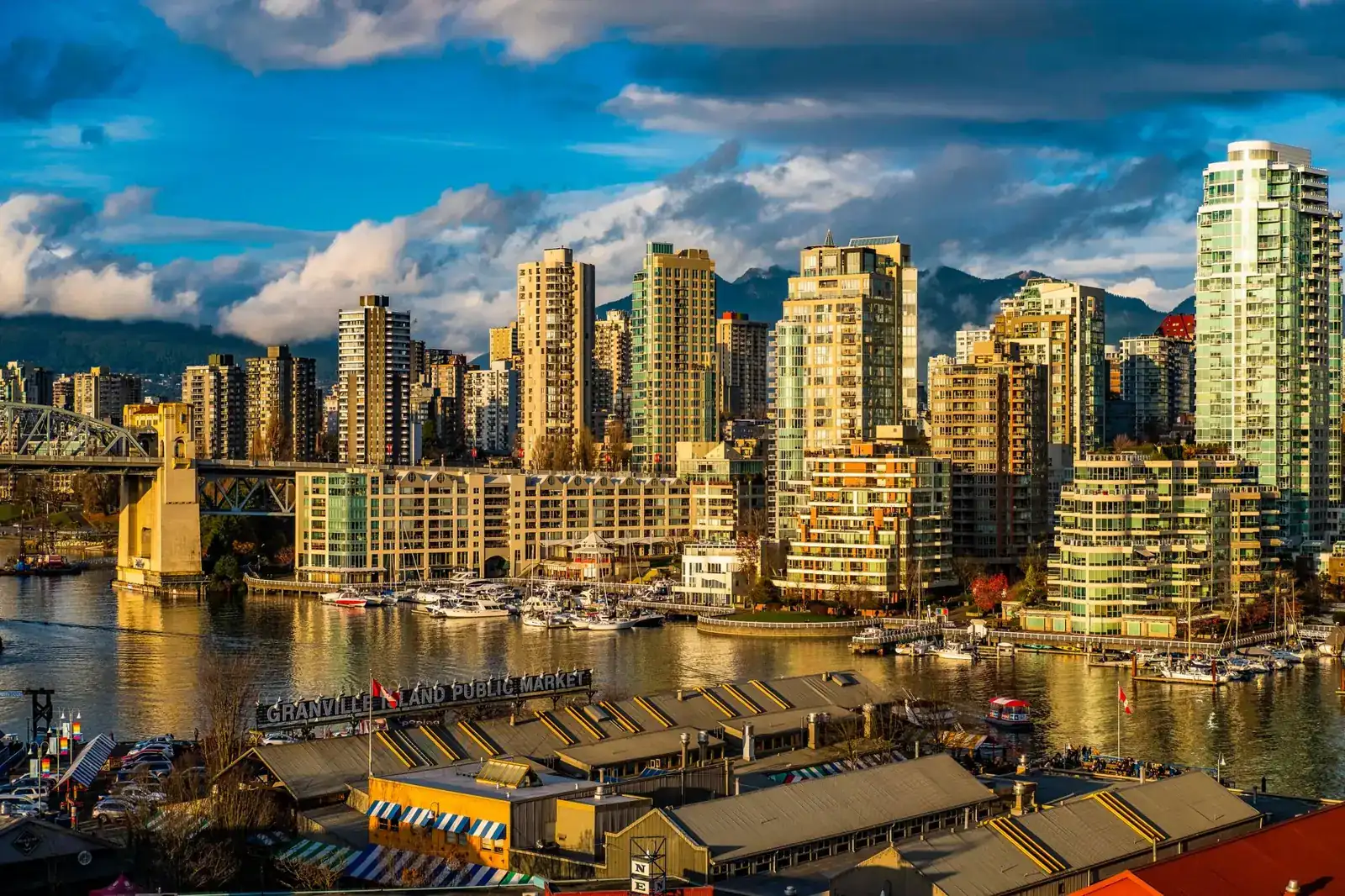 Granville Island Public Market and False Creek marinas with Vancouver towers behind