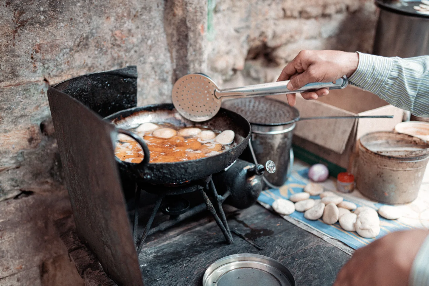 A vendor preparing street snacks at a Varanasi market