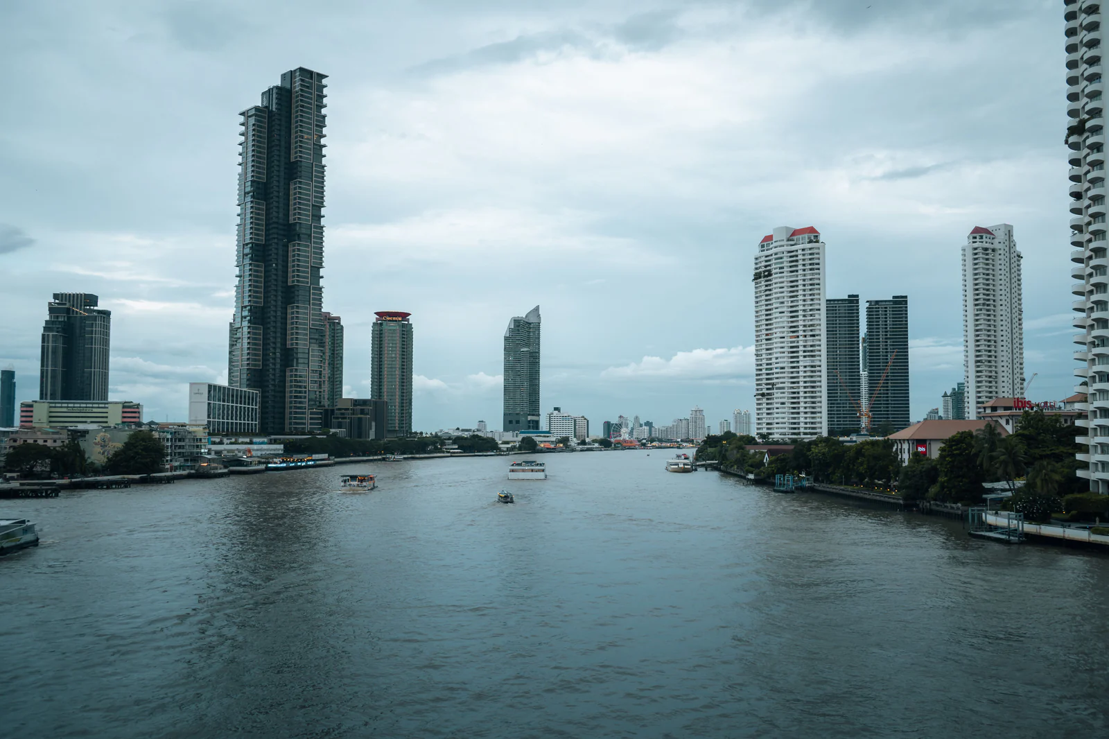 Bangkok’s modern skyline lining both sides of the Chao Phraya River.
