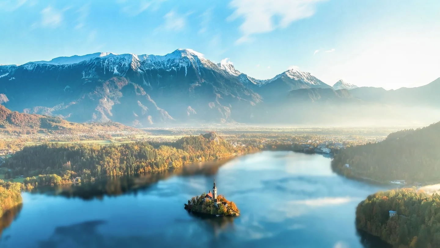 Lake Bled and its church-topped island beneath the surrounding mountain landscape