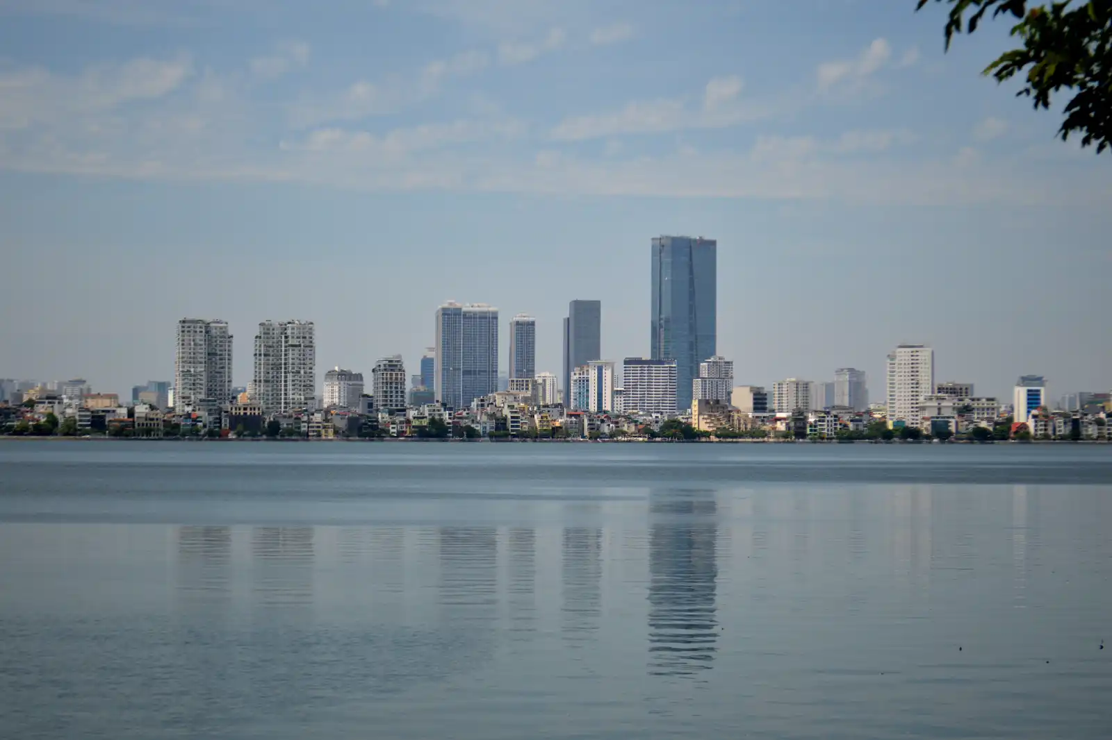 Hanoi’s skyline reflected across West Lake.