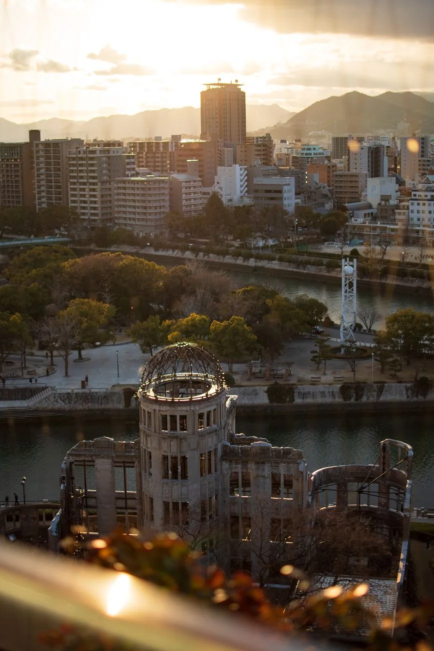 Hiroshima’s Atomic Bomb Dome, Motoyasu River and Peace Memorial Park seen from above at sunset