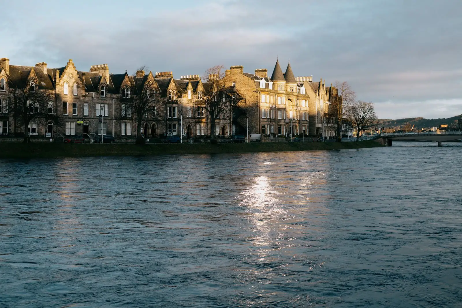 Victorian buildings reflected in the River Ness in Inverness