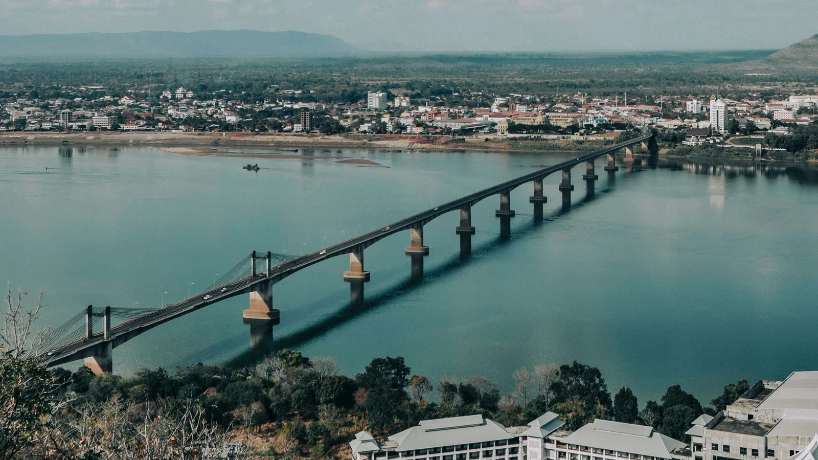 The Lao–Japanese Bridge crosses the Mekong towards the city of Pakse.