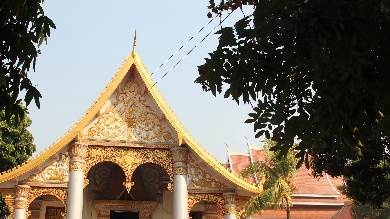 The decorated gable and entrance of Wat Sainyaphum in Savannakhet.